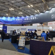 部品メーカーから整備工場の“伴走者”へー。アイシンが初披露した「新型故障診断機」と「Amazonとの連携サービス」…IAAE2026